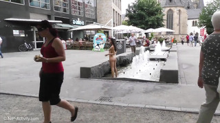 Kira Walks Completely Nude In A German Town