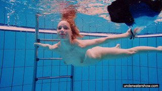 Redhead Slut Swimming Naked In The Pool