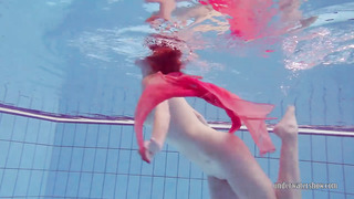 Redhead Dancing In The Pool