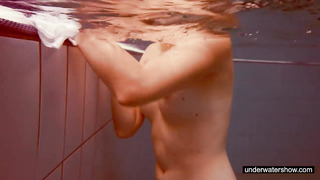 Cute Redhead Plays Naked Underwater